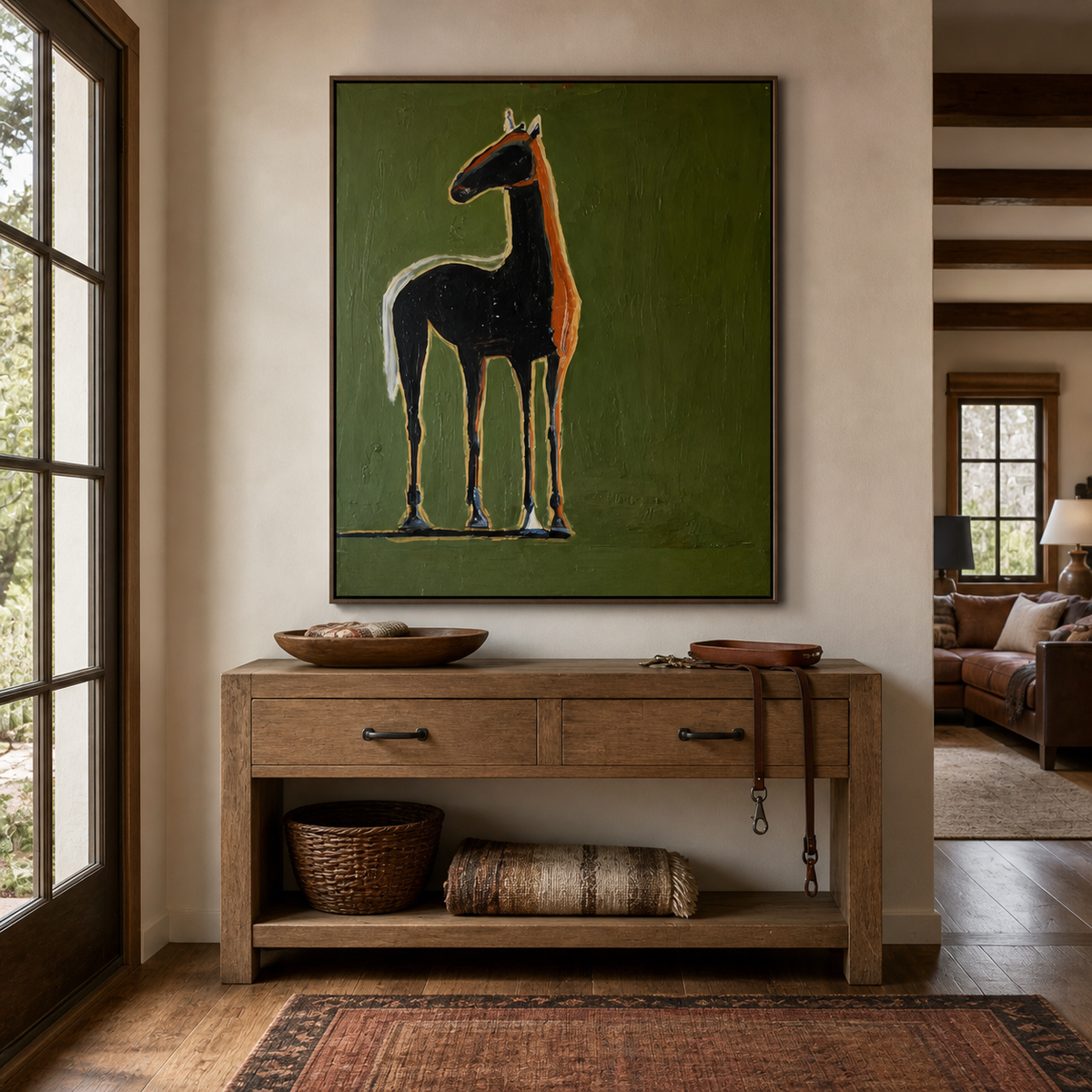 Black horse wall art with warm ochre outlines on an olive-green background above an entryway console.