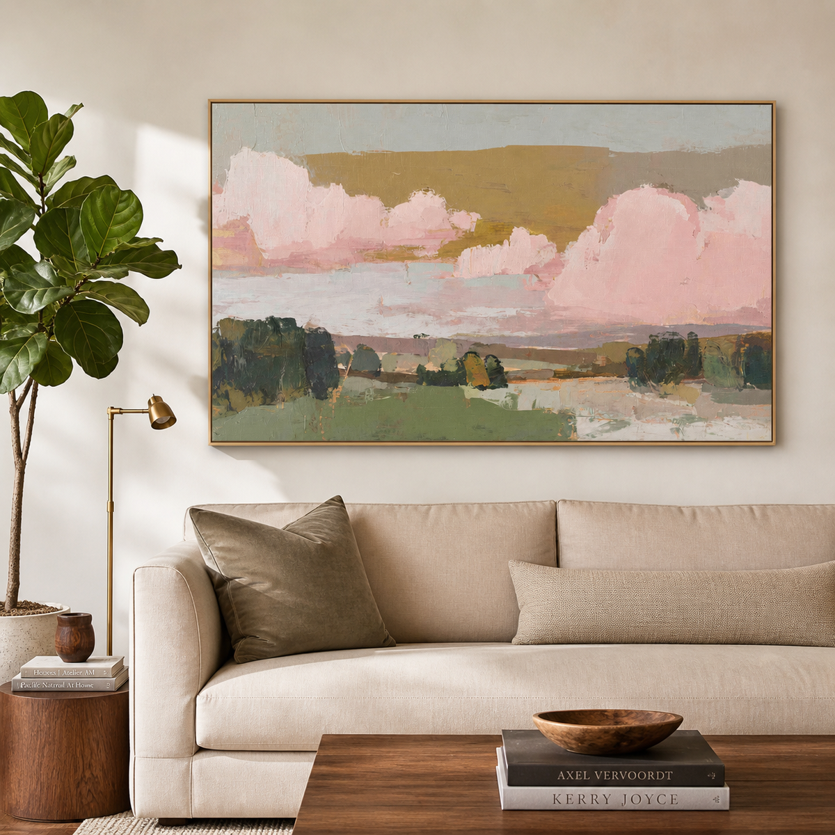 Pink and green abstract landscape wall art with blush clouds and layered fields displayed above a neutral living room sofa.