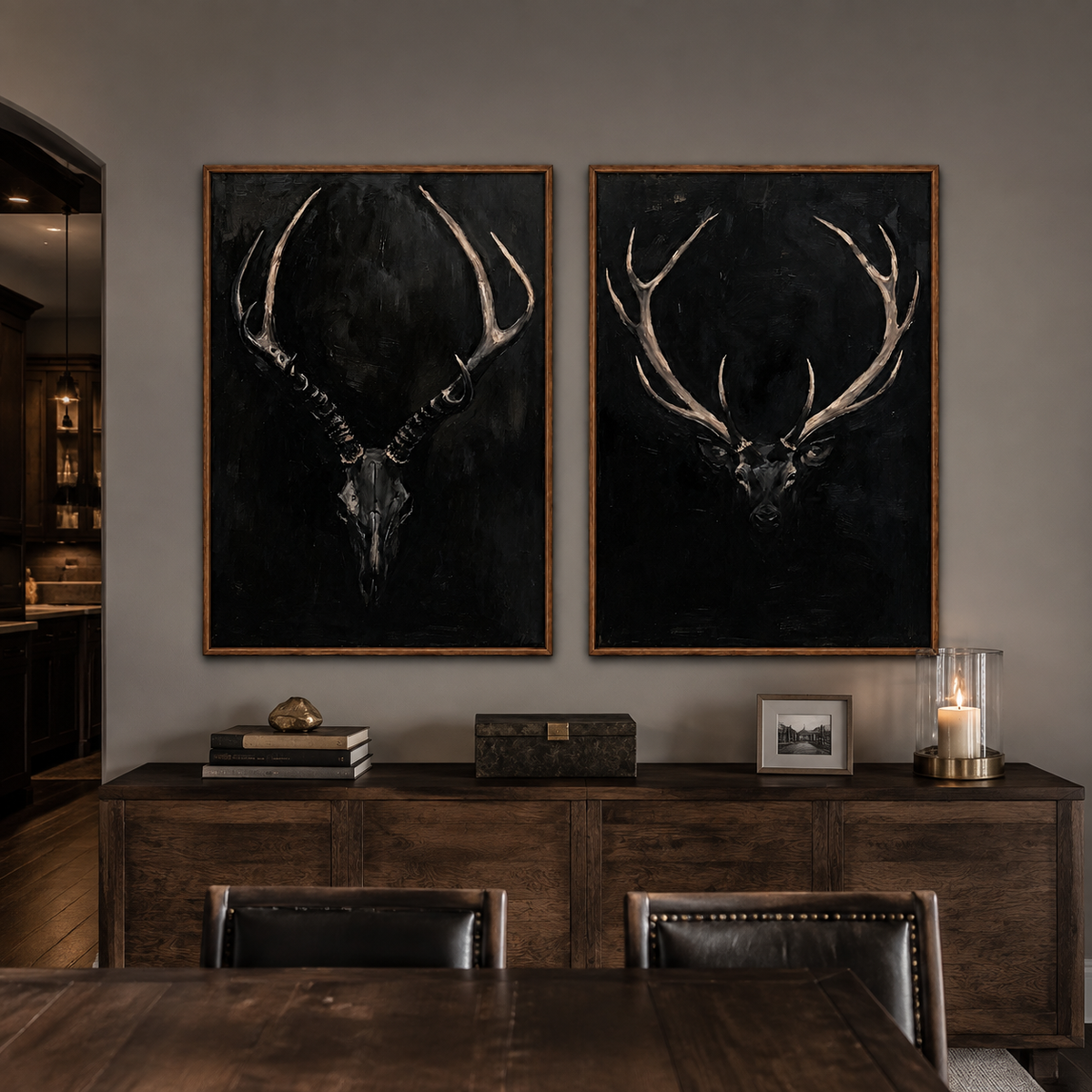 An antlered skull and a stag head against black backgrounds, in a dining room.