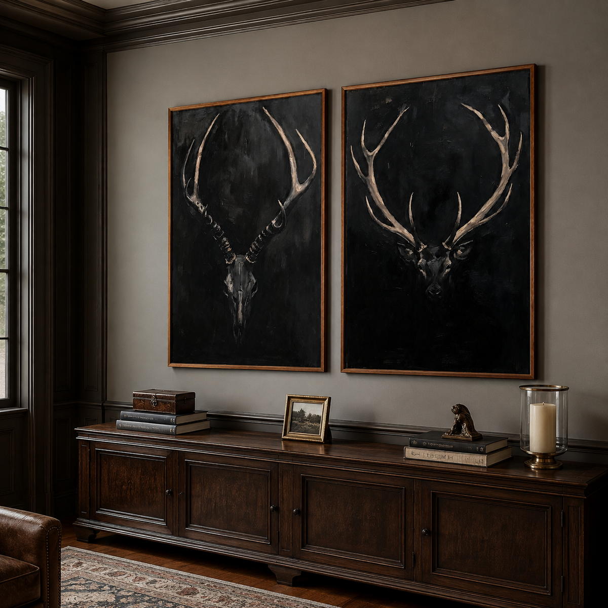 An antlered skull and a stag head against black backgrounds, shown from an angle in a study.