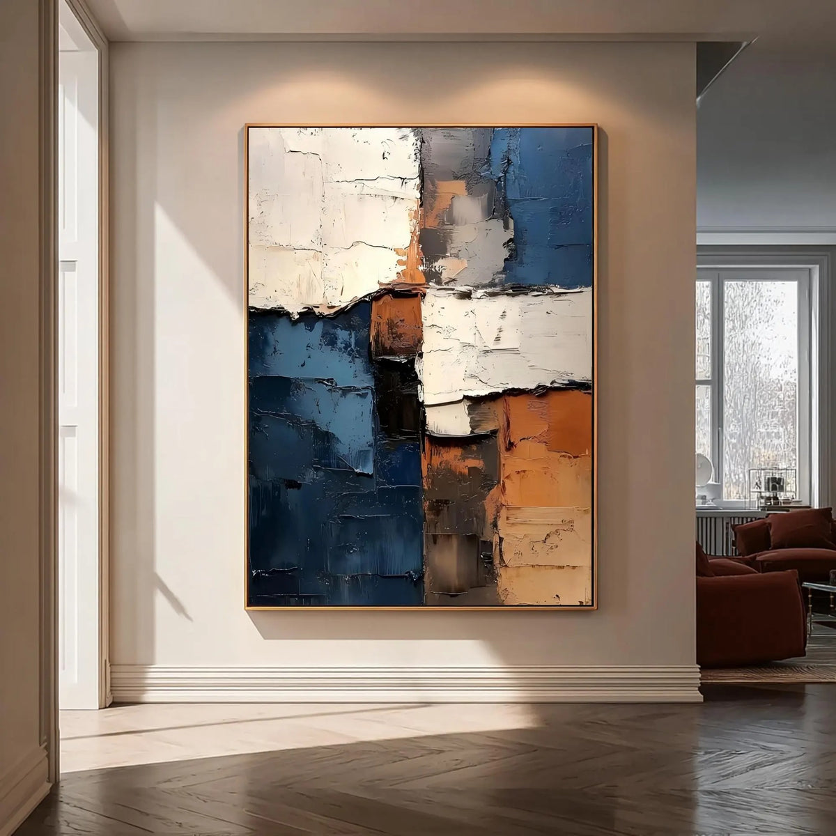 Rough-edged blocks of deep blue, ivory and rust orange in a vertical abstract composition, shown in room setting 6.