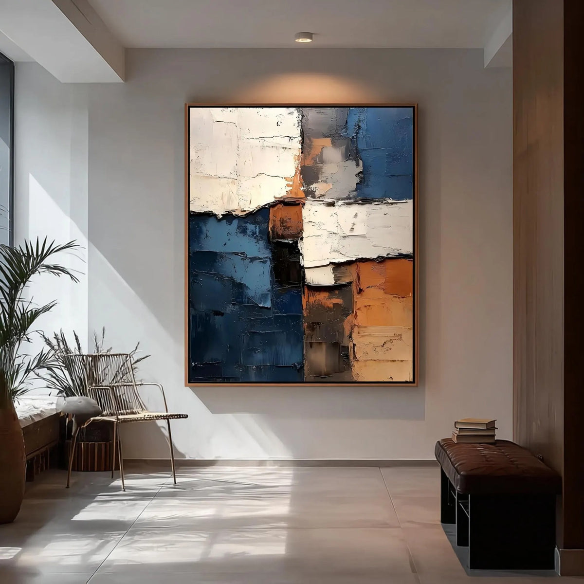 Rough-edged blocks of deep blue, ivory and rust orange in a vertical abstract composition, shown in room setting 7.