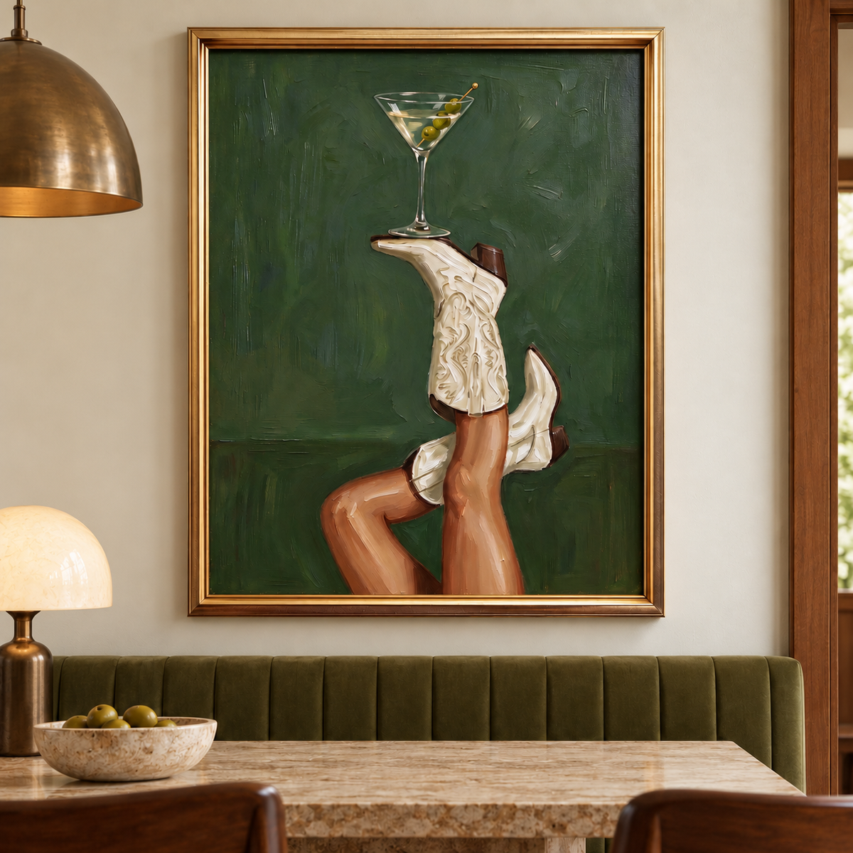 Two raised legs wearing white cowboy boots with decorative scroll patterns, one boot balancing a martini glass with olives against a dark green background, shown in room setting 2.
