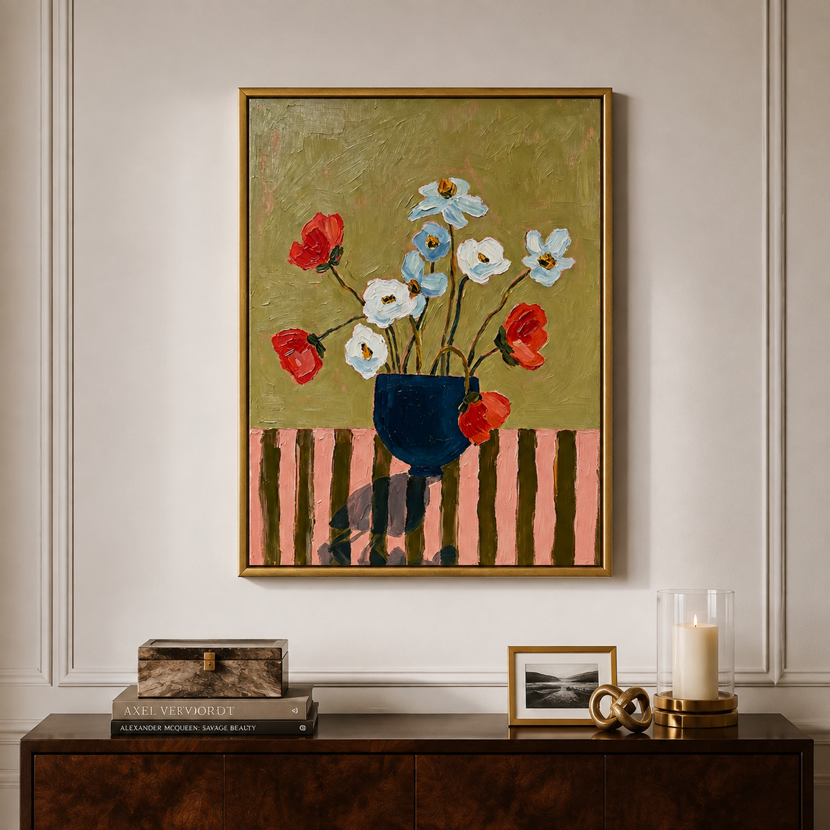Red, white, and pale blue flowers in a navy vase against an olive background, in a living room.