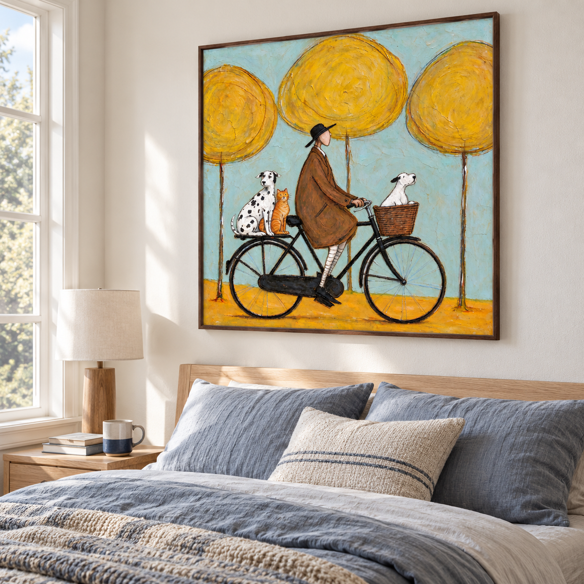 A man in a brown coat riding a black bicycle with a white dog in the front basket and a Dalmatian and orange cat on the rear rack beneath three round yellow trees against pale blue, shown in room setting 5.