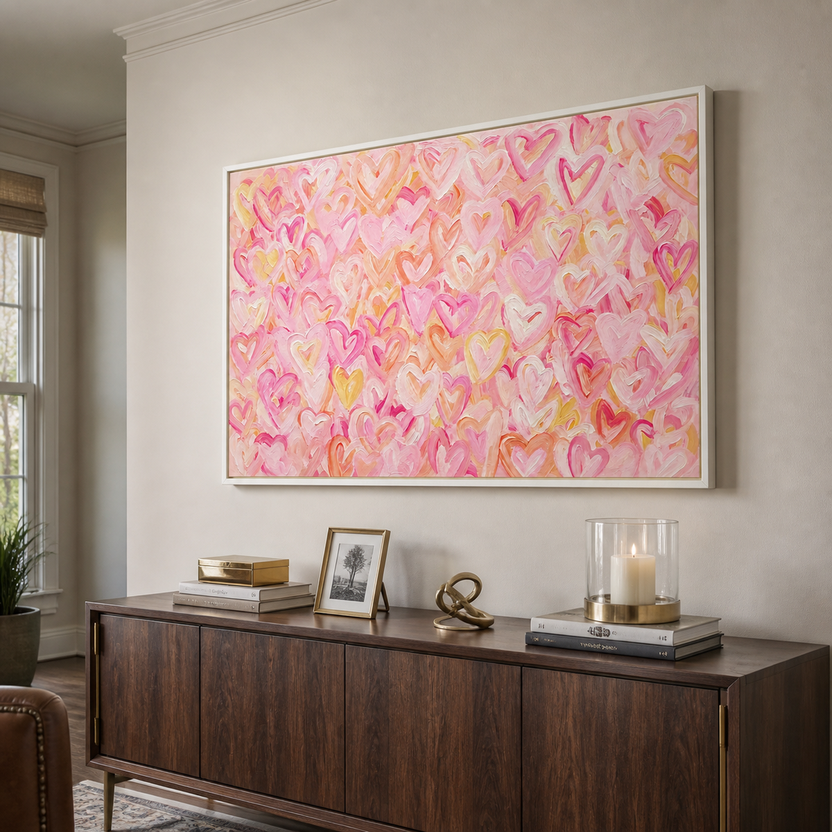Pink, peach, and yellow hearts layered across a warm pink background, shown from an angle in a study.