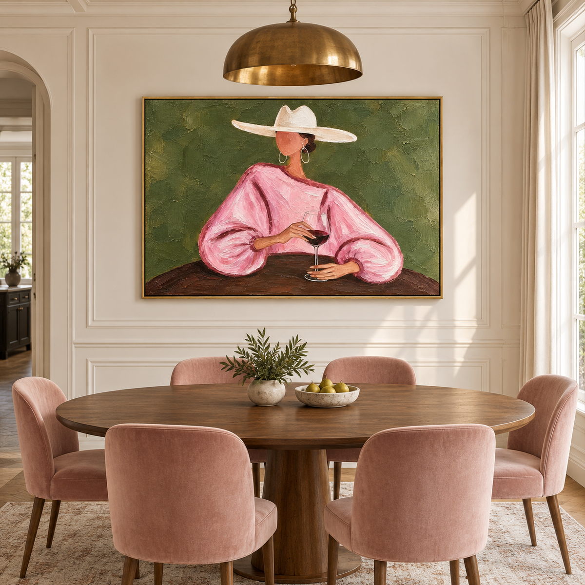 A woman in a loose pink blouse and wide white cowboy hat holding a glass of red wine at a dark table against an olive-green background, shown in room setting 1.