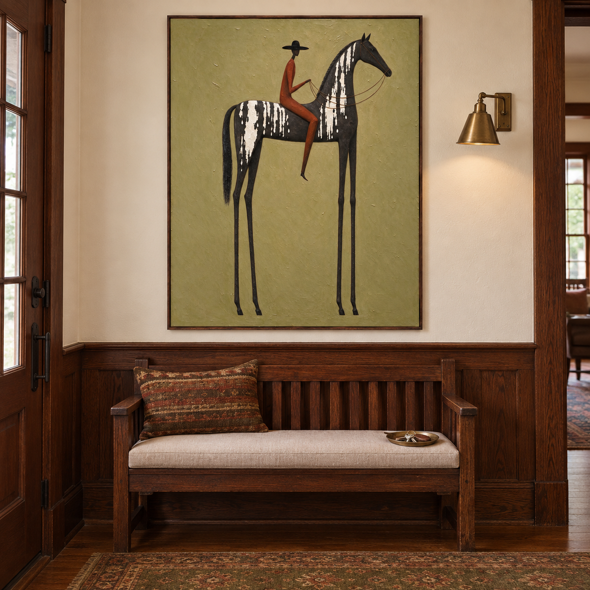 A rust-colored rider in a black hat on a tall narrow black horse with white markings against light olive green, in a Craftsman-style entryway.