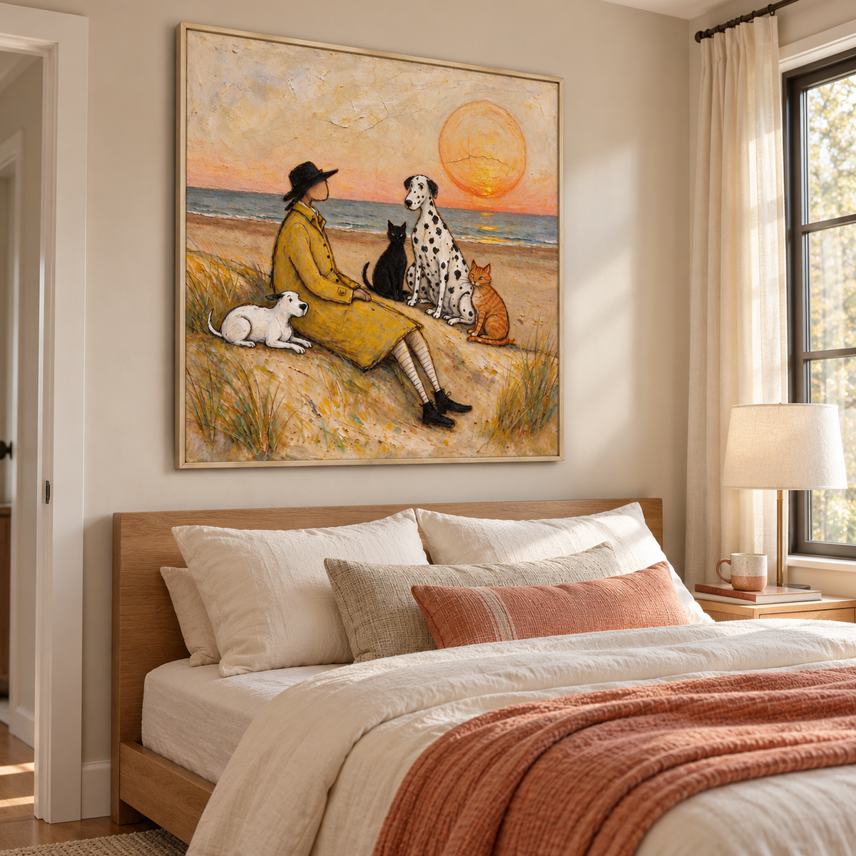 A man in a yellow coat sitting on a sandy beach with a small white dog, a Dalmatian, a black cat and an orange cat beneath a large orange setting sun, shown in room setting 5.