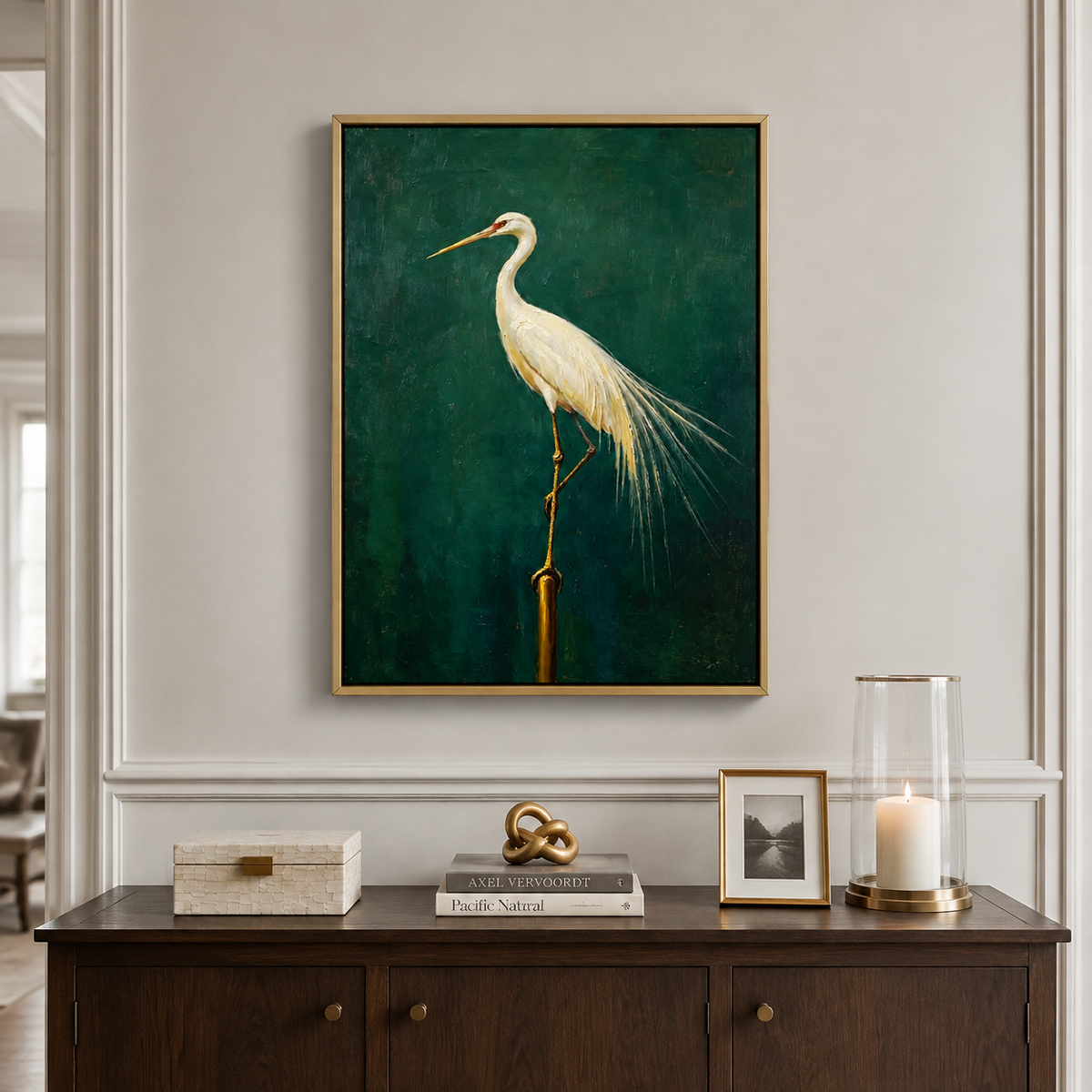 White egret with long trailing feathers perched against a deep green background, in a dining room.