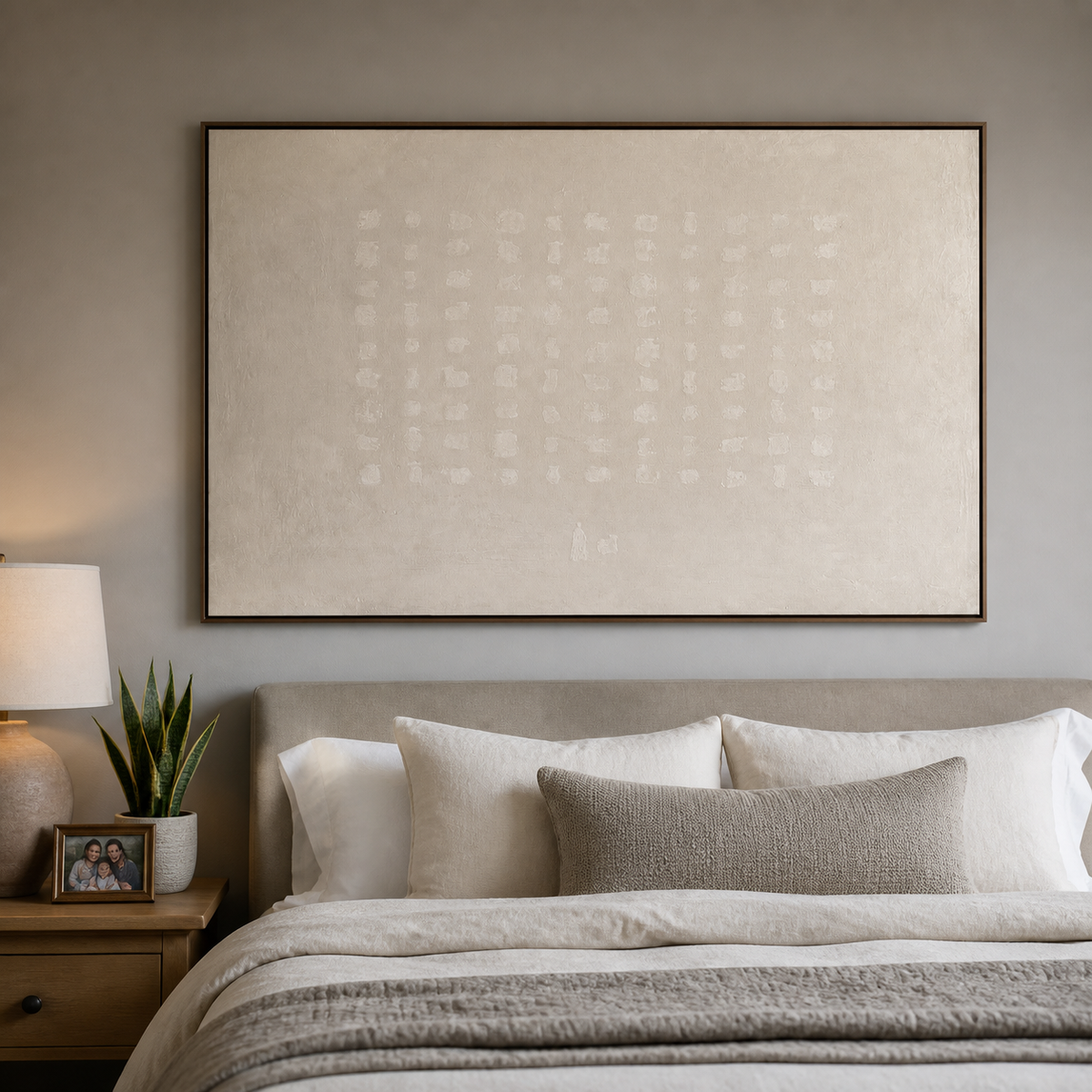 Neutral ivory textured wall art with a subtle white grid pattern displayed above a wooden dining table.