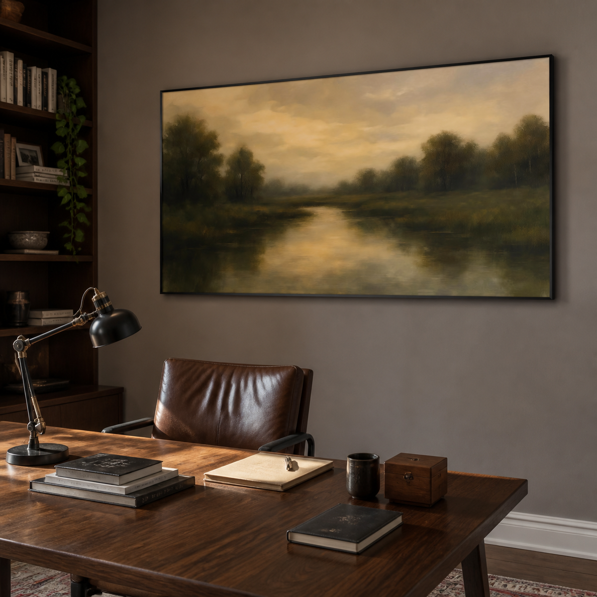 Panoramic moody river landscape wall art with dark green trees and golden reflections displayed above a neutral living room sofa.