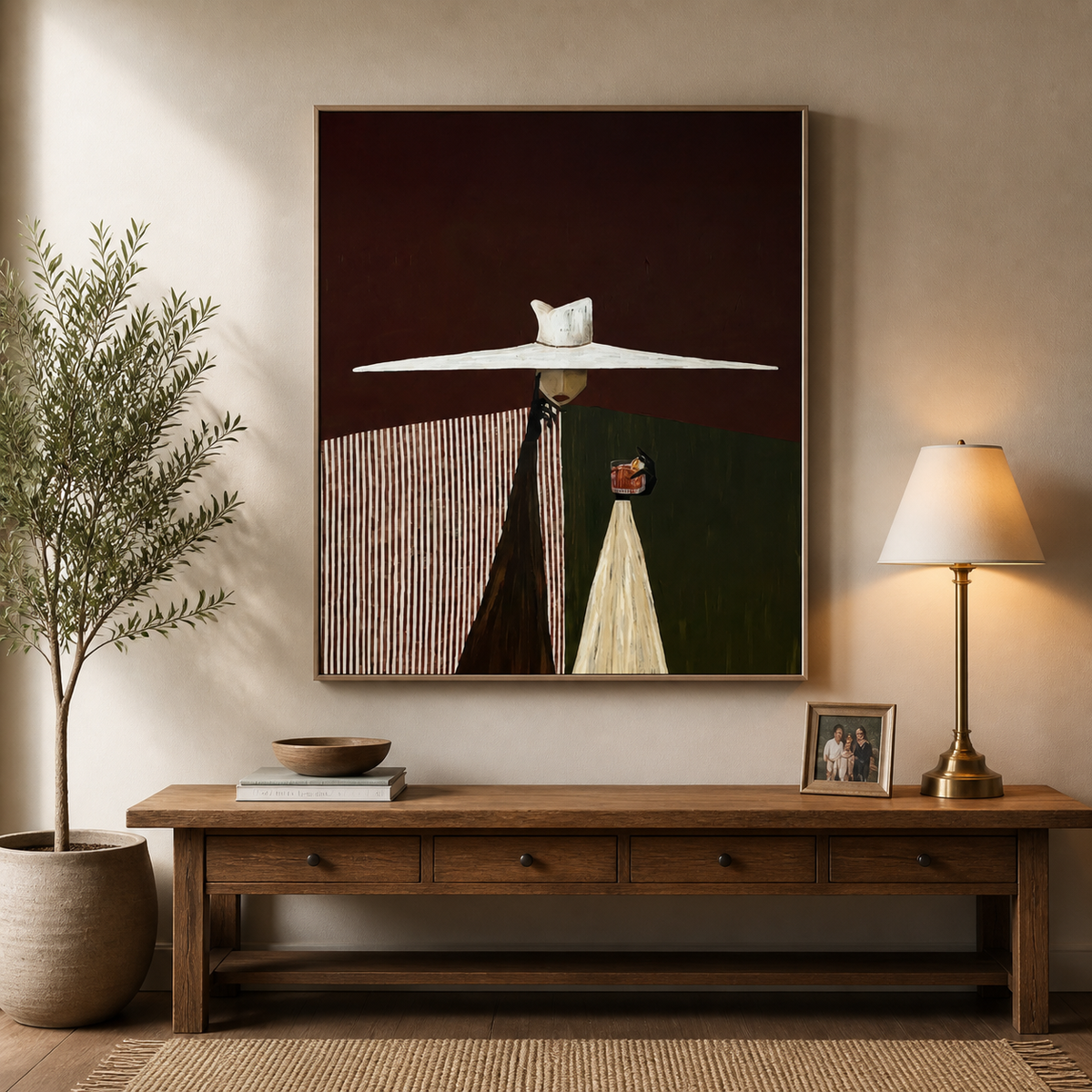 Modern Western couple wall art with two stylized figures beneath a wide white hat displayed above a neutral sofa.