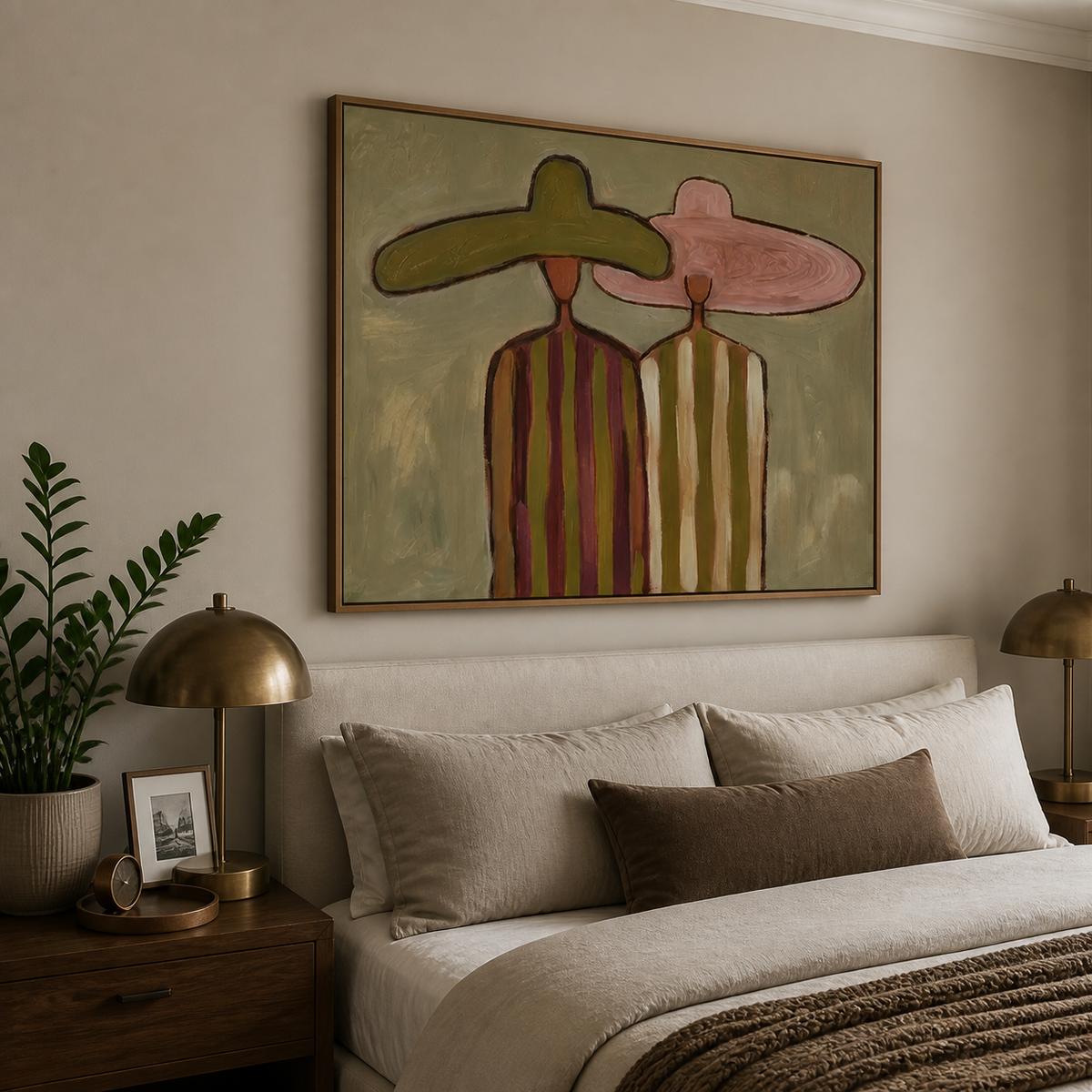Horizontal Western wall art of two cowboys in olive and pink hats displayed above a neutral living room sofa.
