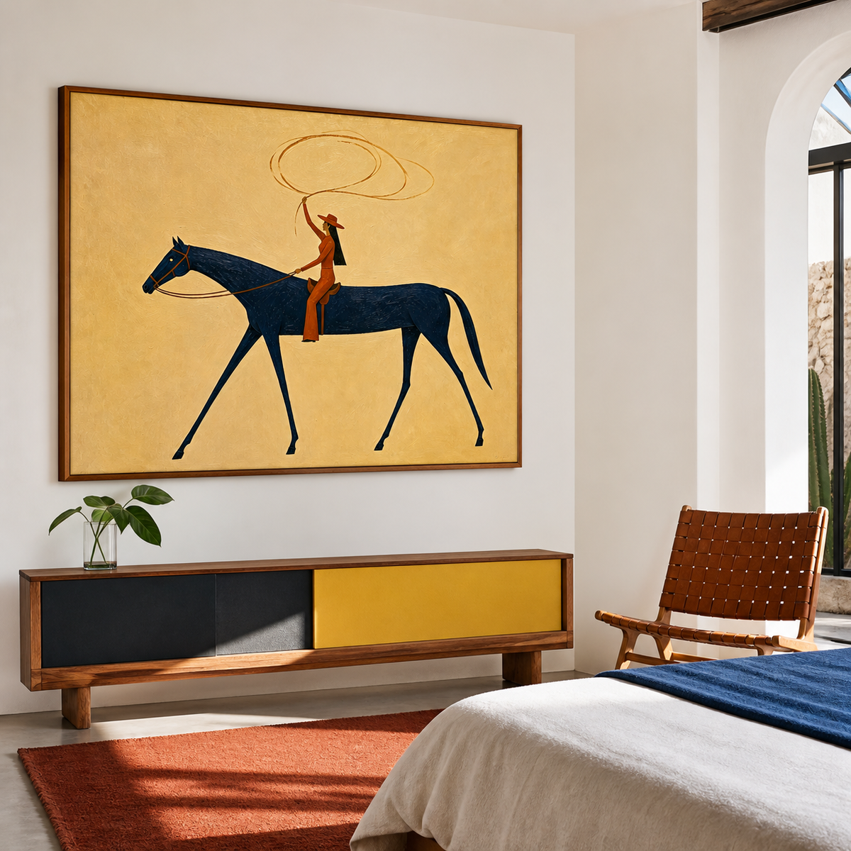 Vintage Americana cowgirl wall art featuring a Western rider swinging a lasso while riding a navy blue horse against a textured cream background.