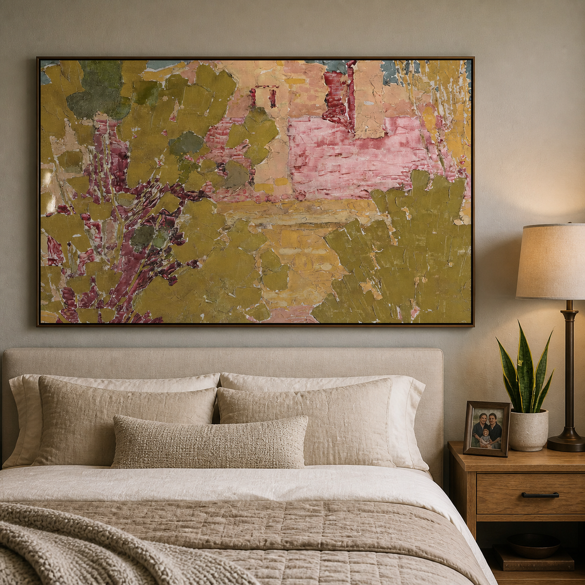Pink and olive green textured abstract wall art with garden-inspired forms displayed above a wooden dining table.