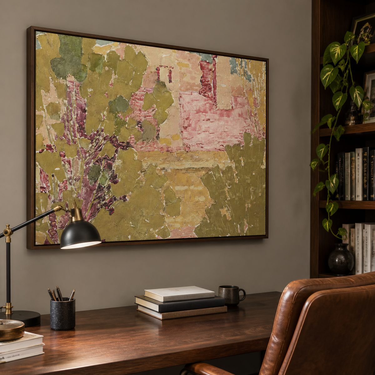 Pink and olive green textured abstract wall art with garden-inspired forms displayed above a wooden dining table.