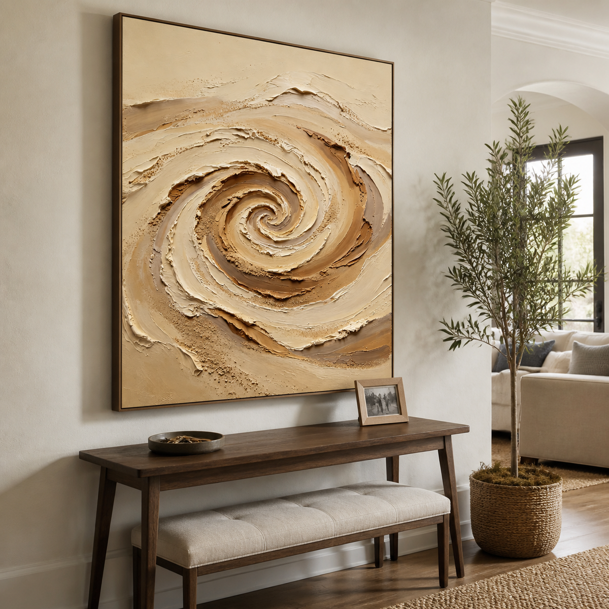 Neutral textured wall art featuring a raised beige, ivory, and taupe spiral with sand-like granular details.