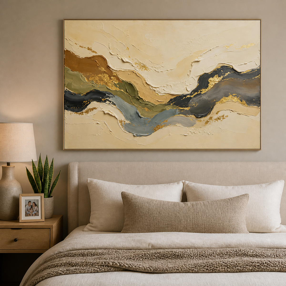 Neutral textured wall art with flowing beige, olive, blue-gray and black layers with gold accents displayed above a wooden dining table.