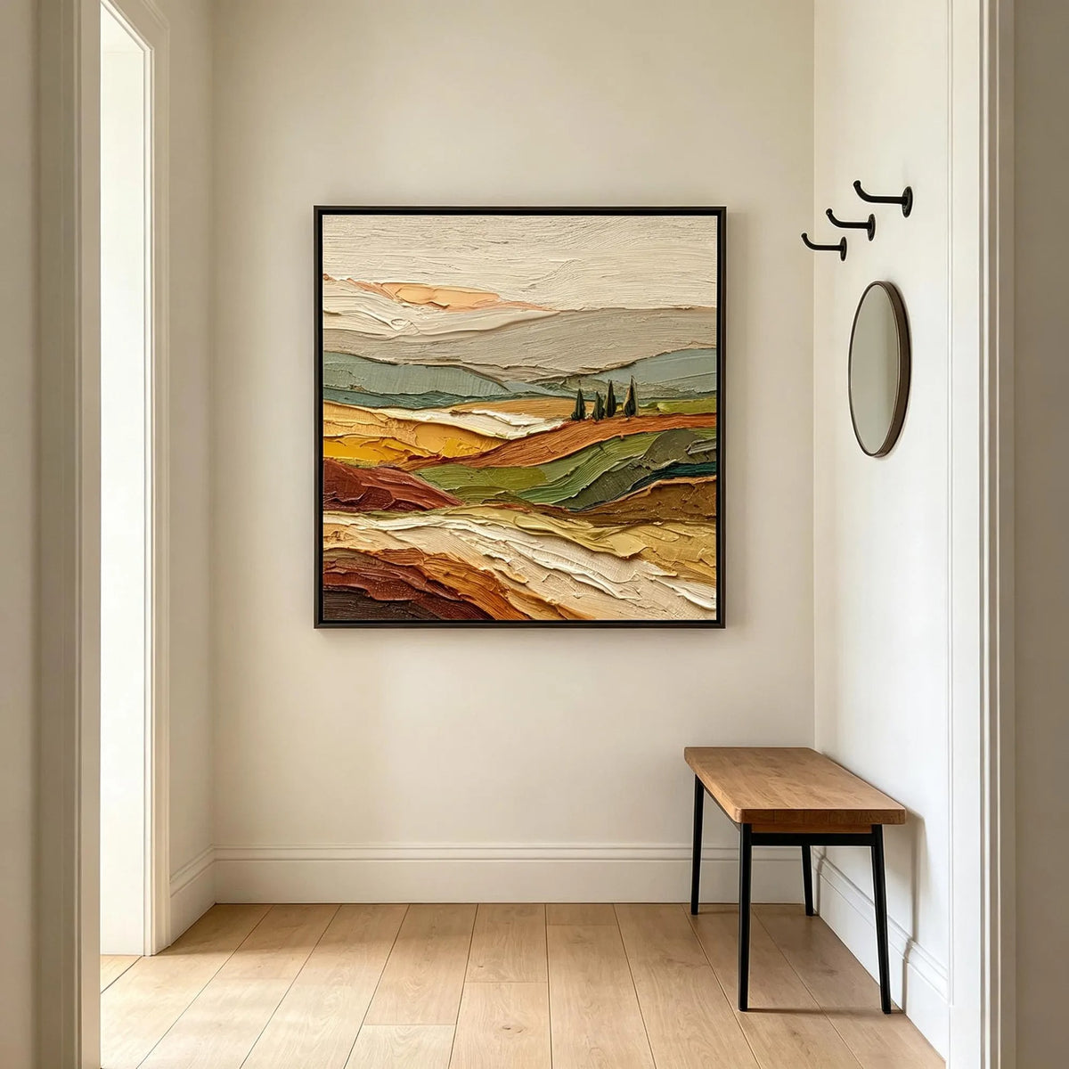 Rolling fields in ochre, rust and muted green with a small cluster of dark trees beneath a pale sky, shown in room setting 1.