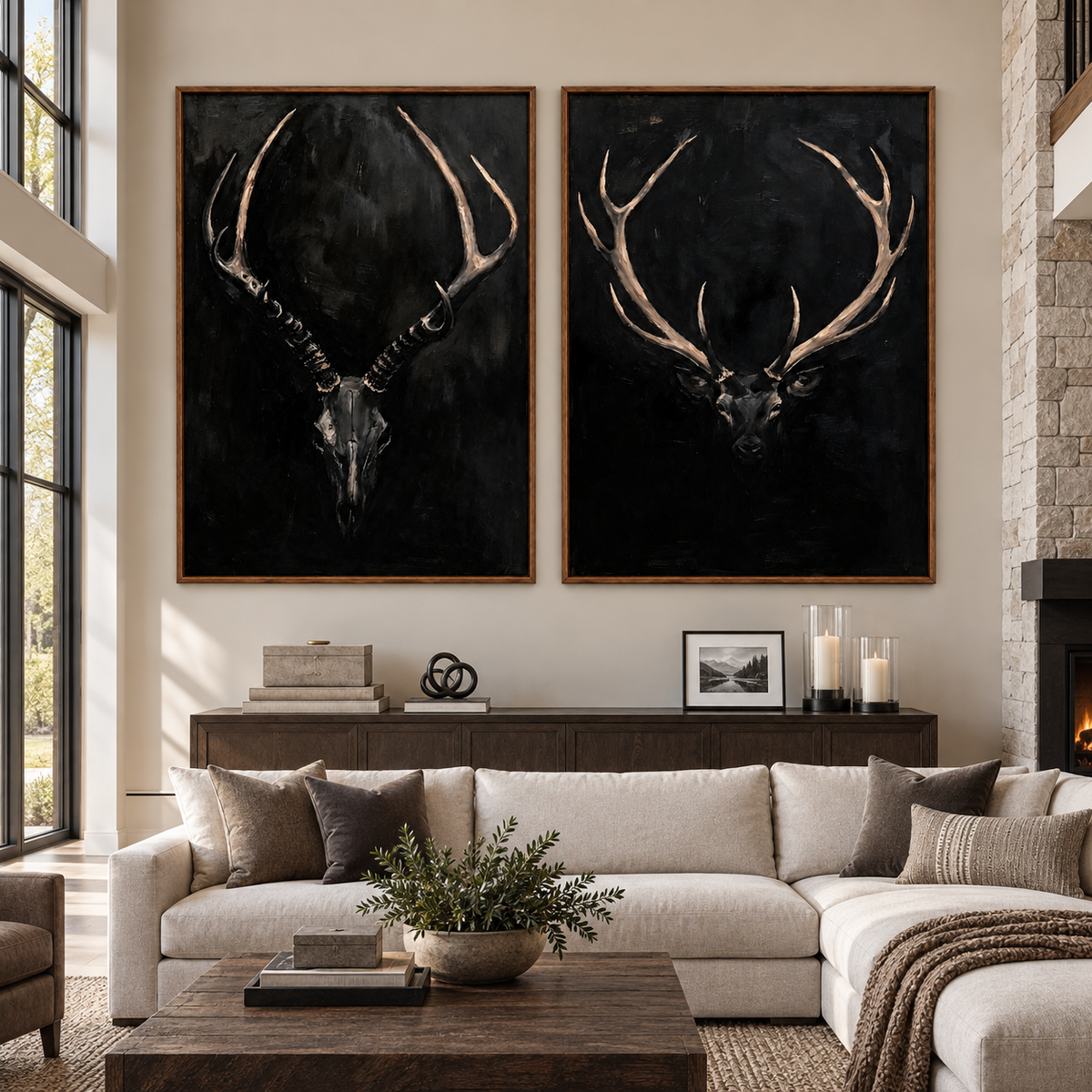 An antlered skull and a stag head against black backgrounds, in a large living room.