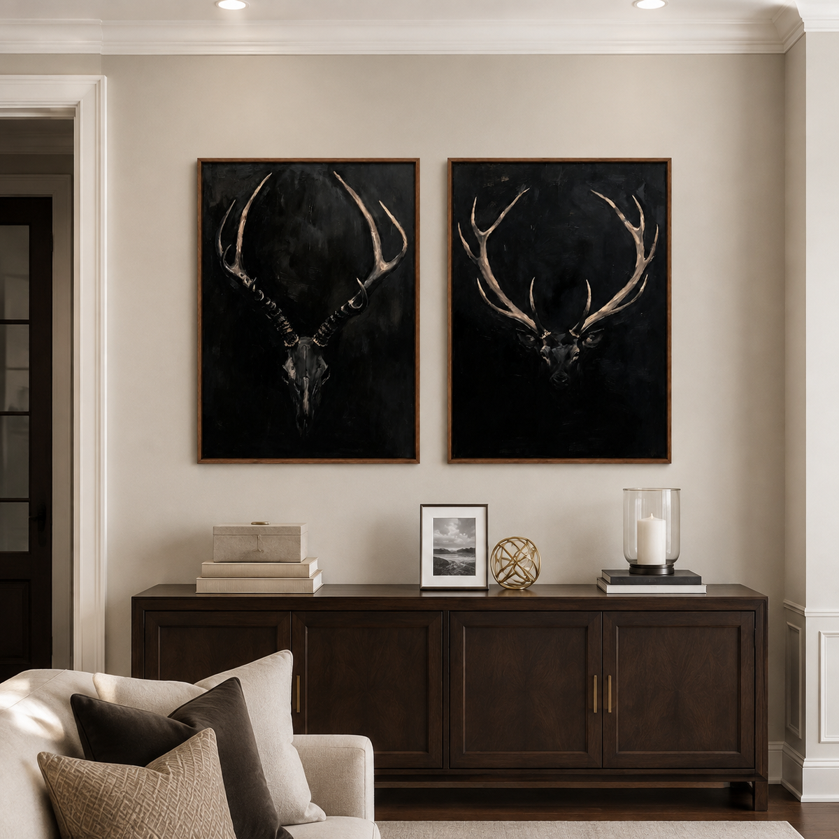 An antlered skull and a stag head against black backgrounds, in a living room.