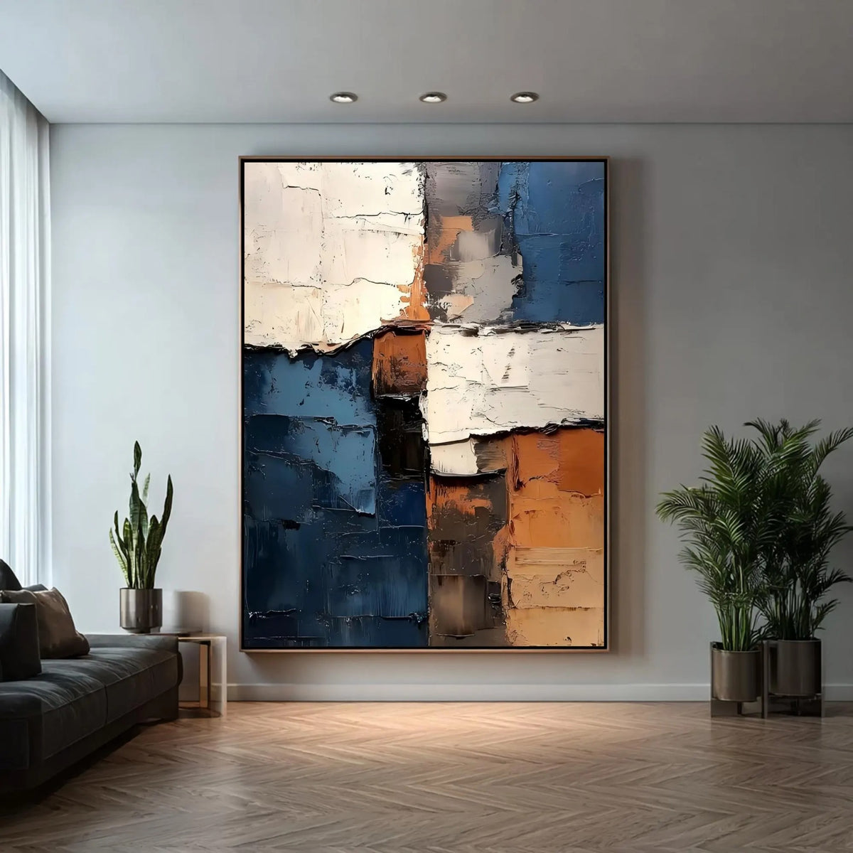 Rough-edged blocks of deep blue, ivory and rust orange in a vertical abstract composition, shown in room setting 1.
