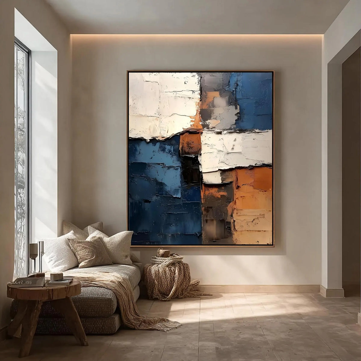 Rough-edged blocks of deep blue, ivory and rust orange in a vertical abstract composition, shown in room setting 4.