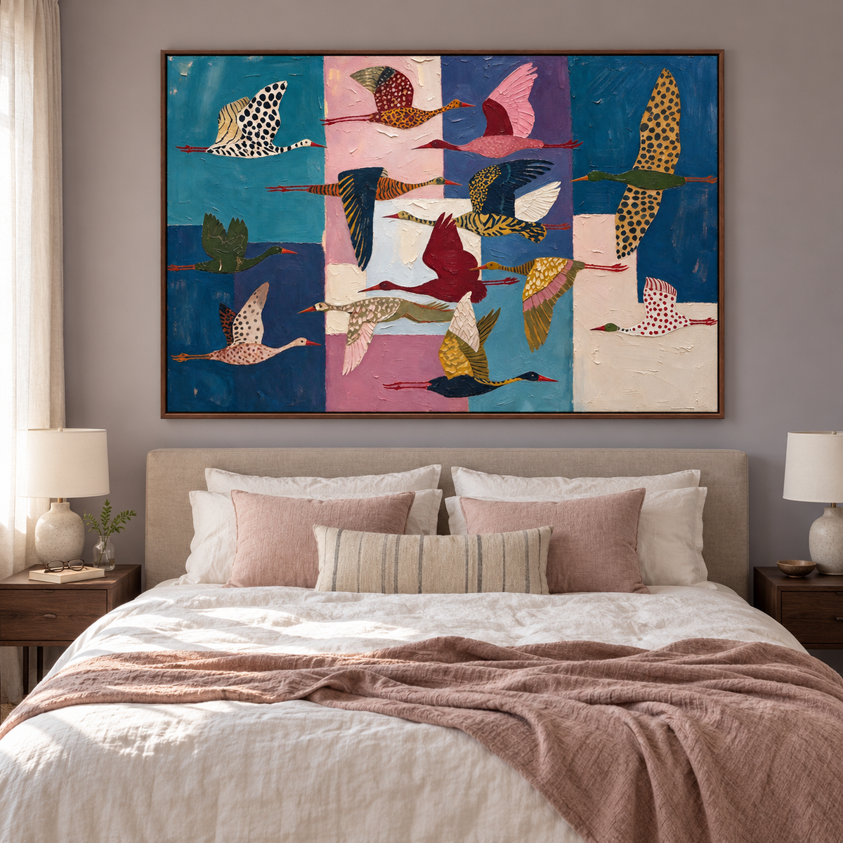 Colorfully patterned flying birds against deep blue, teal, pink, and cream blocks, above a bed in a contemporary bedroom.