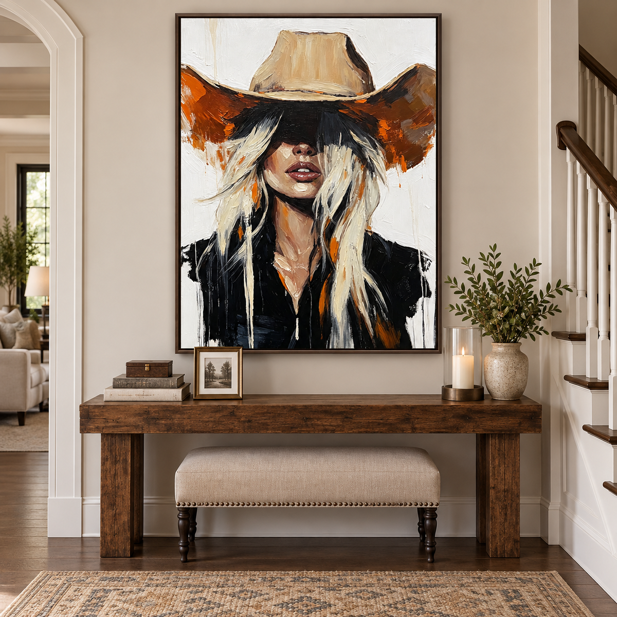 Blonde cowgirl in a wide tan hat and black jacket against a white background, in an entryway.