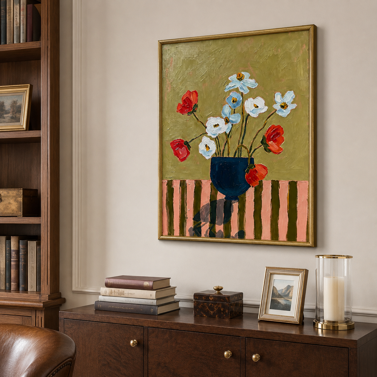 Red, white, and pale blue flowers in a navy vase against an olive background, shown from an angle in a study.