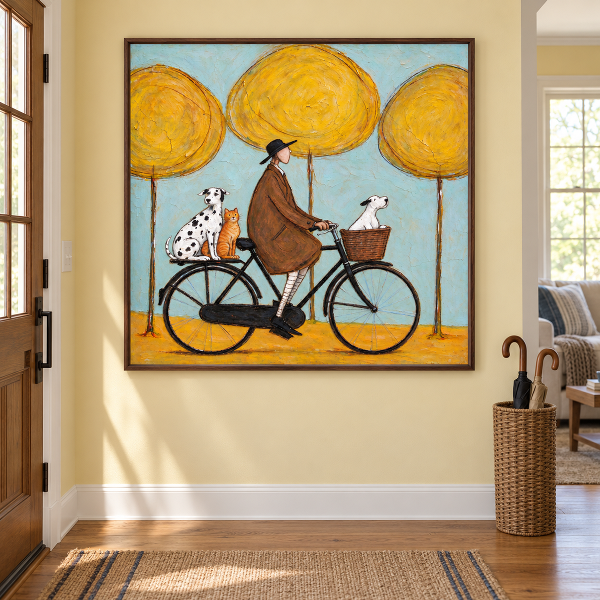 A man in a brown coat riding a black bicycle with a white dog in the front basket and a Dalmatian and orange cat on the rear rack beneath three round yellow trees against pale blue, shown in room setting 3.
