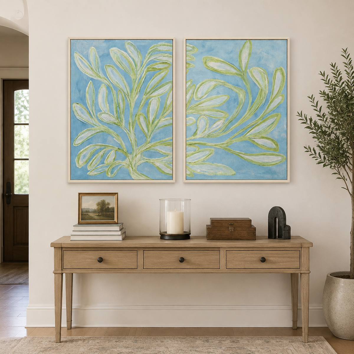 Long green leaves and slender branches across two pale blue panels, in an entryway.