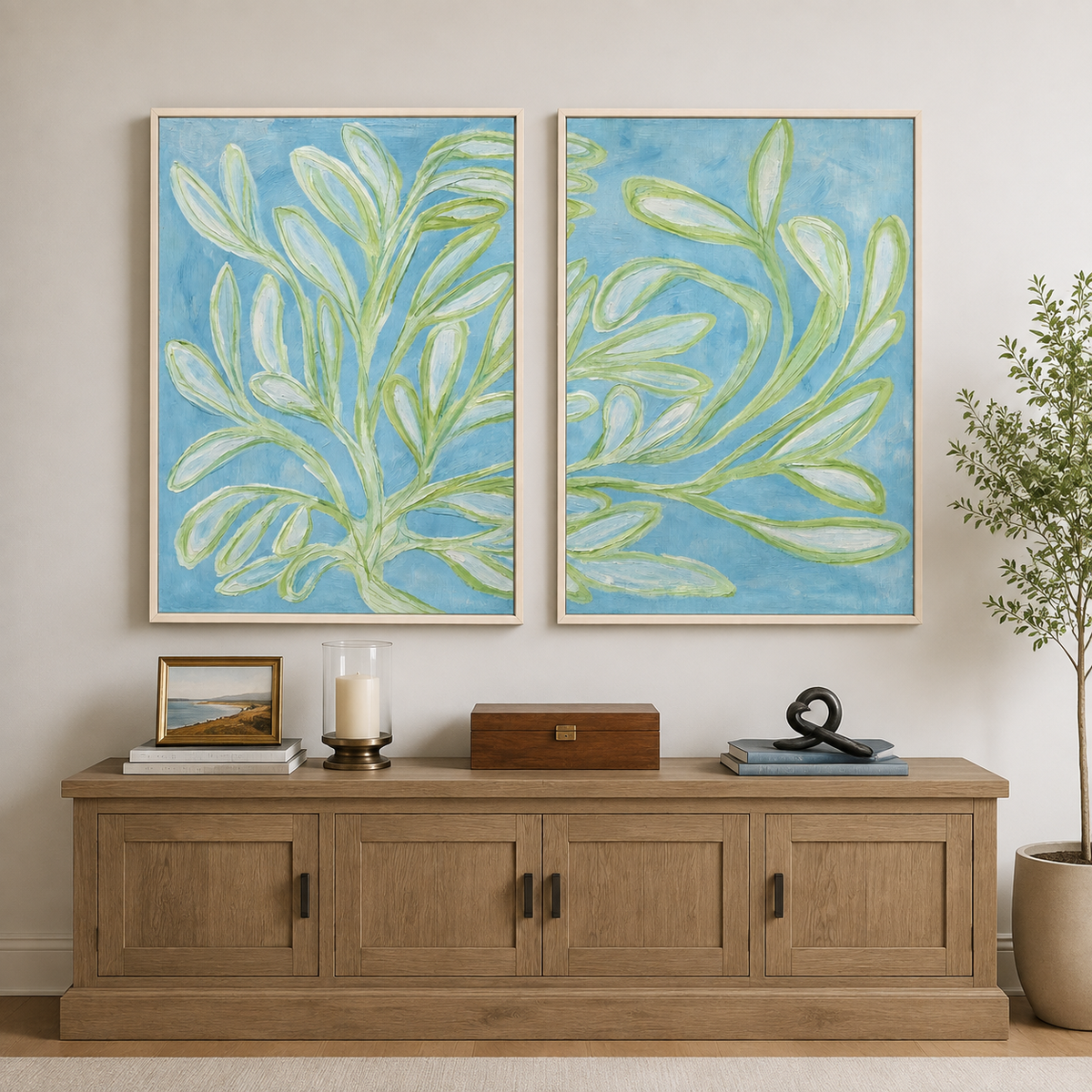 Long green leaves and slender branches across two pale blue panels, in a living room.