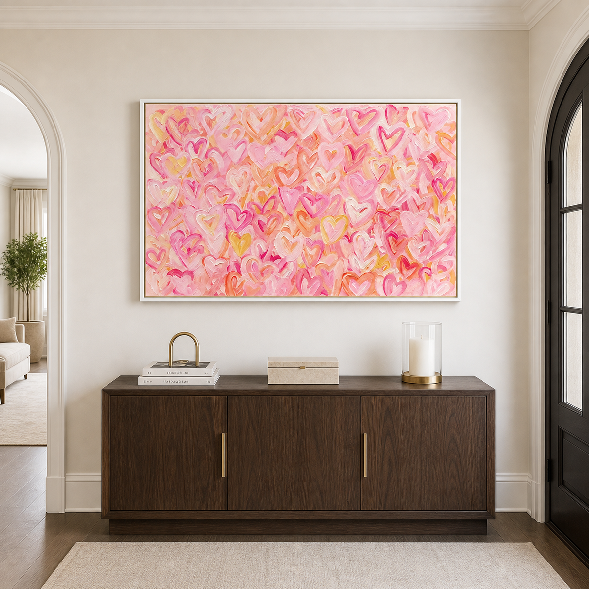Pink, peach, and yellow hearts layered across a warm pink background, in an entryway.