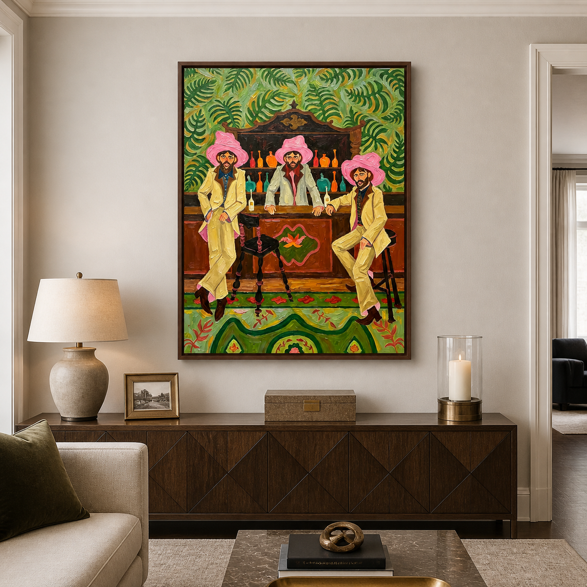 Three men in pink hats at a wooden bar with green leaf patterns and colorful bottles, in a living room.