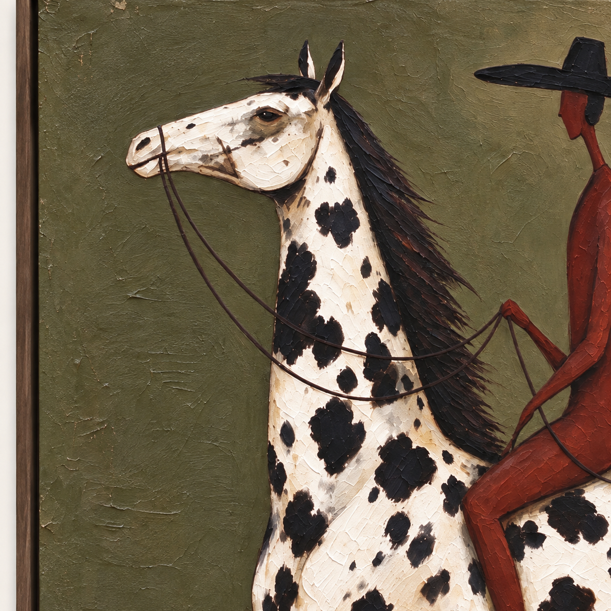 A rust-red rider on a white horse with black spots against olive green, close-up of the spotted horse and rider.