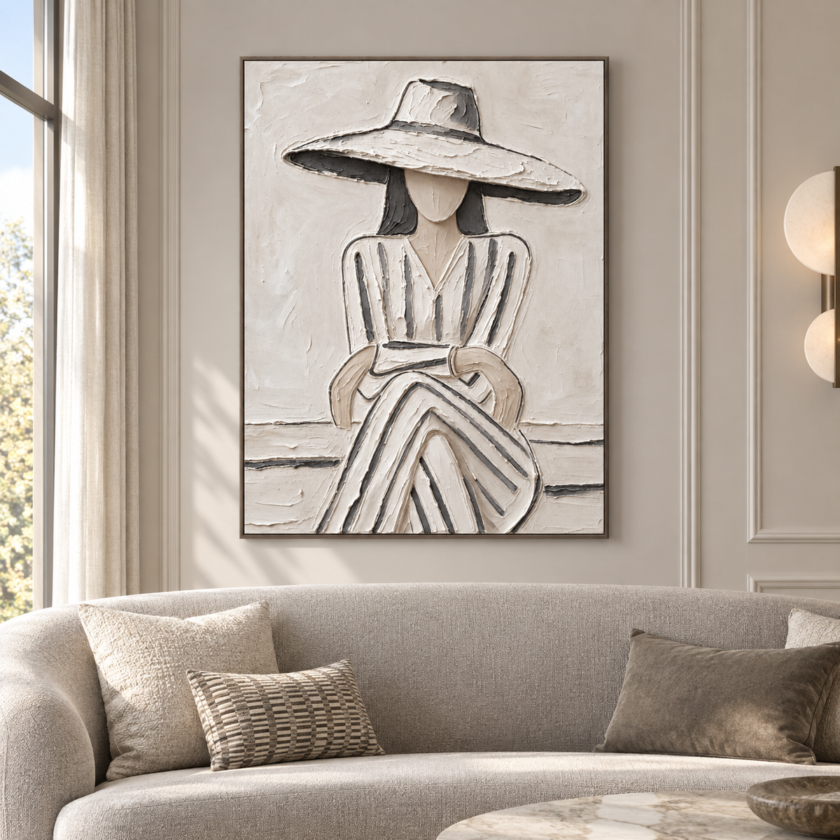 A seated woman in a broad white hat and gray-striped dress with folded hands against a pale background, shown in a french modern living room.