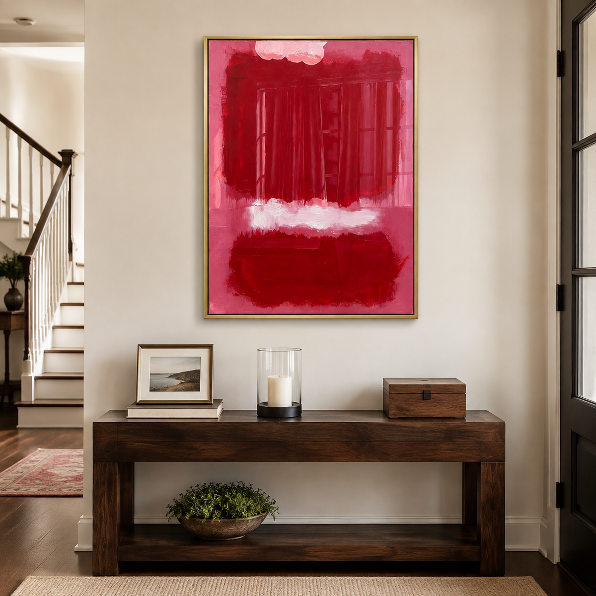 Deep red abstract blocks on dusty rose pink with a pale horizontal brushstroke, in an entryway.