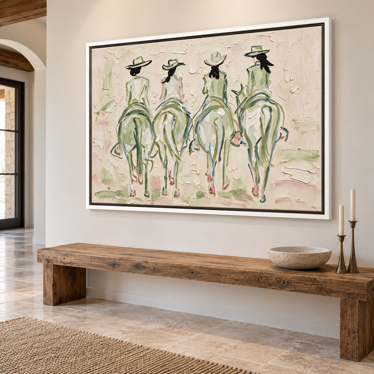 Four cowgirls on horseback seen from behind, with wide-brimmed hats and long dark ponytails, outlined in sage green and pale pink against a cream background, shown in room setting 4.