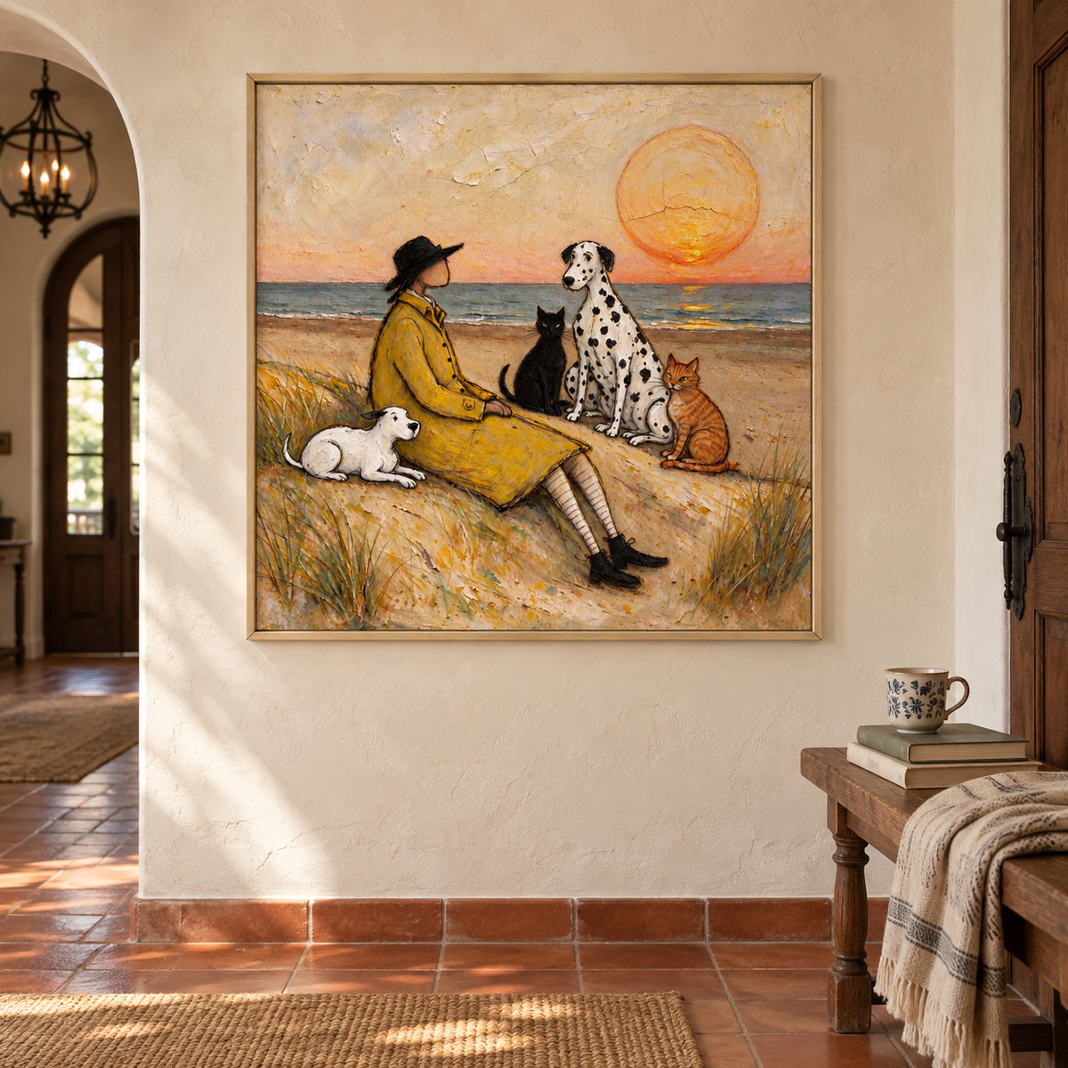 A man in a yellow coat sitting on a sandy beach with a small white dog, a Dalmatian, a black cat and an orange cat beneath a large orange setting sun, shown in room setting 2.