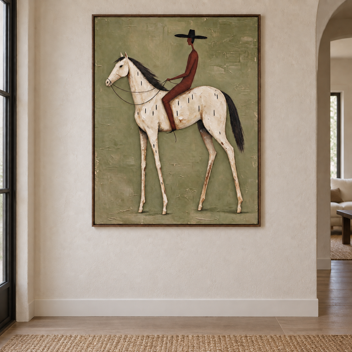 A rust-red rider in a black hat on a white horse against an olive green background, in an organic modern entryway.